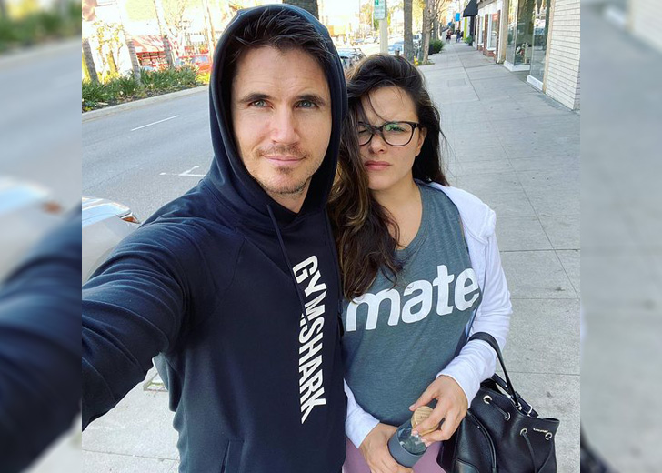 Robbie Amell taking a selfie with his wife Italia Ricci