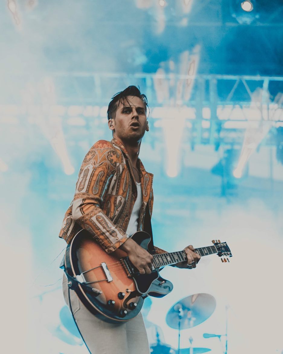 Mark Foster performing on stage.