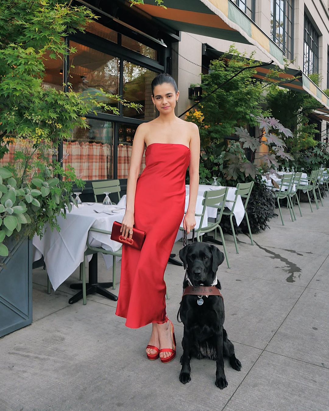 Aria Mia Loberti with her guide dog Ingrid