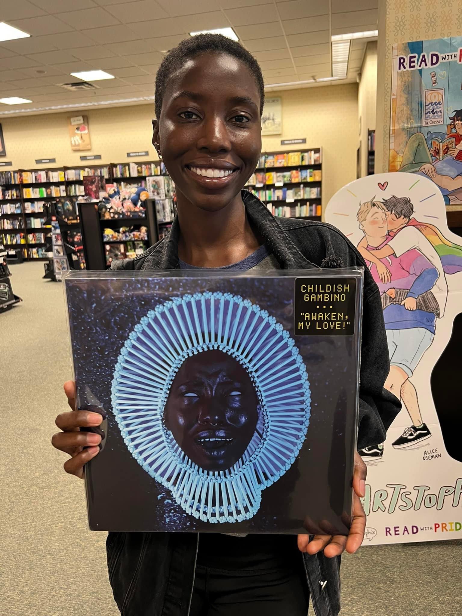 Giannina Antonette Oteto, Awaken My Love album cover model, holding a vinyl pressing of the album