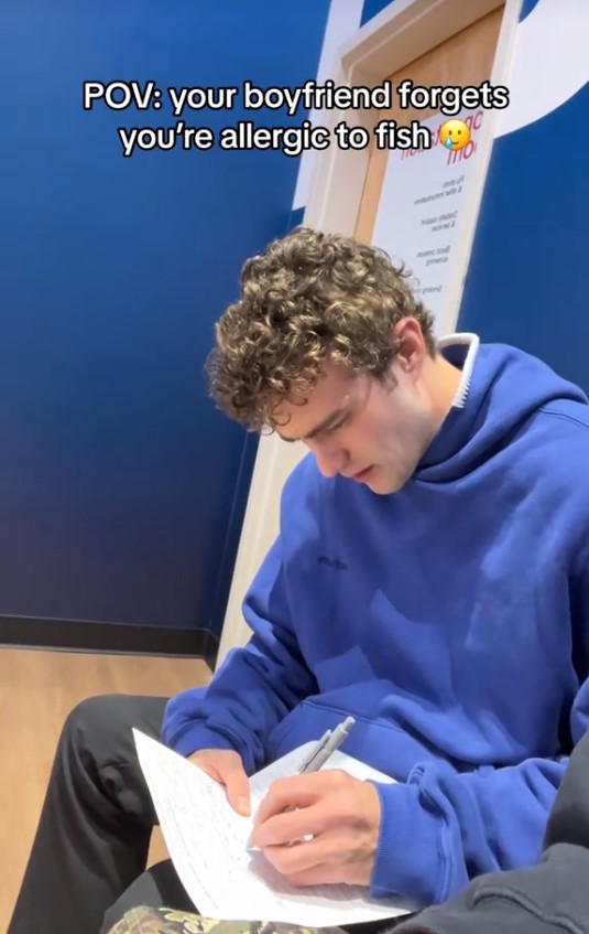 Lexi Hensler's boyfriend, Justice Shepard, filling out a form in the hospital