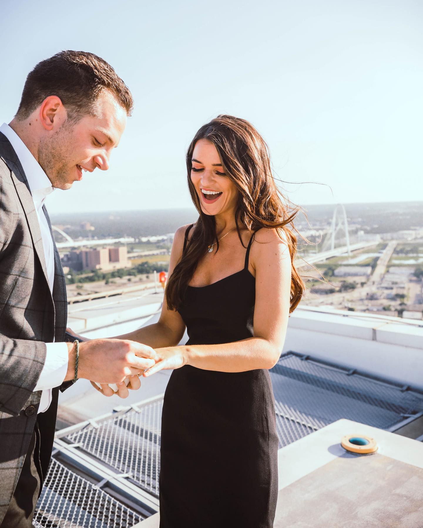 Adam Gottschalk putting on an engagement ring on his now-wife Raven Gates