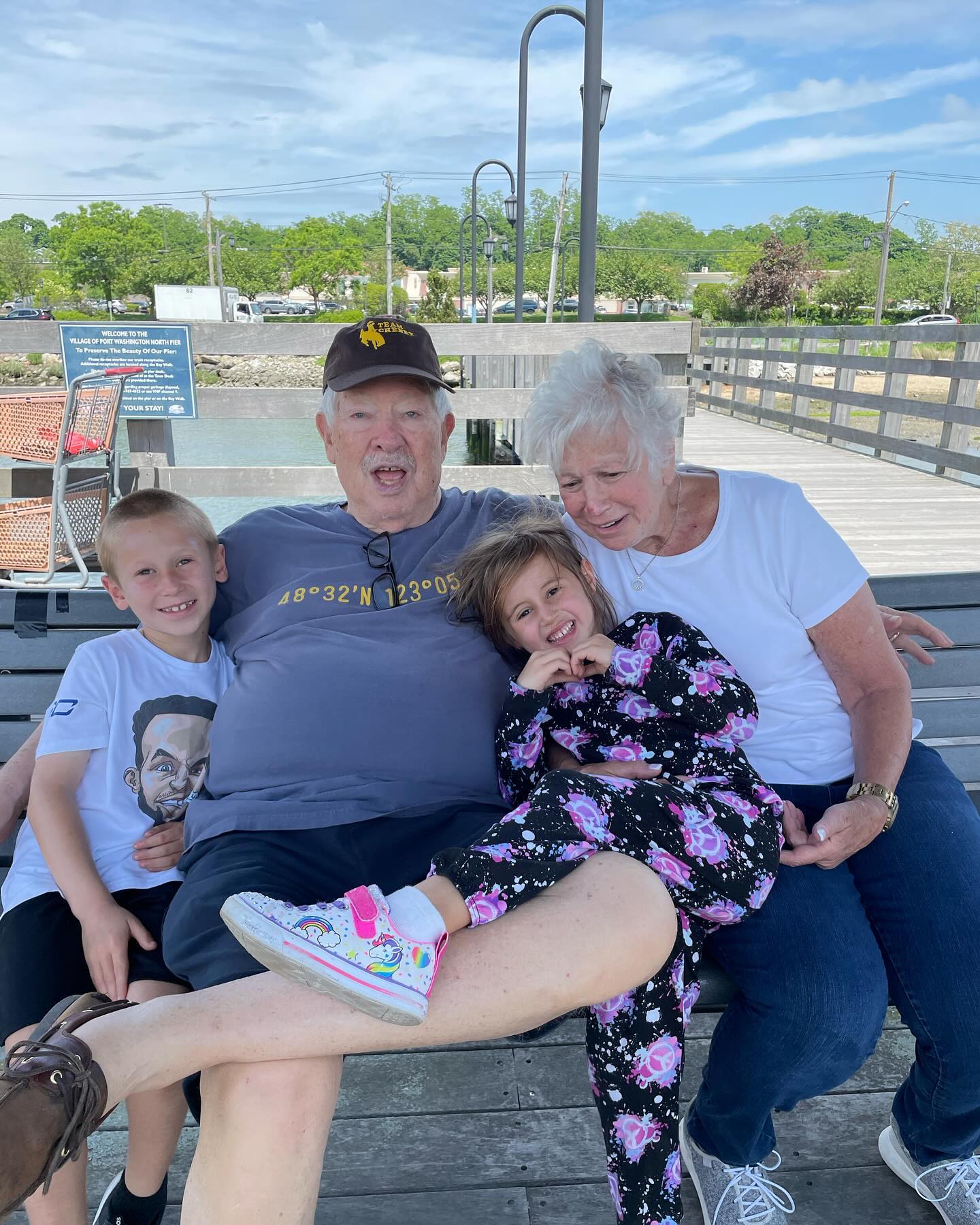 A picture of J.P. Rosenbaum's parents alongside his two children