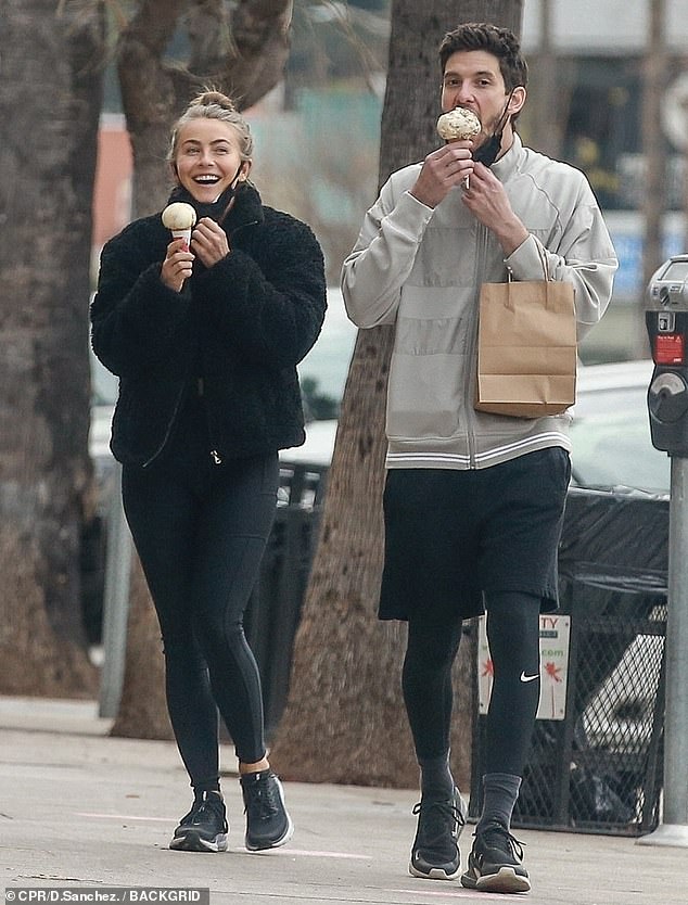 Ben Barnes and Julianne Hough enjoying their walk and ice cream. 