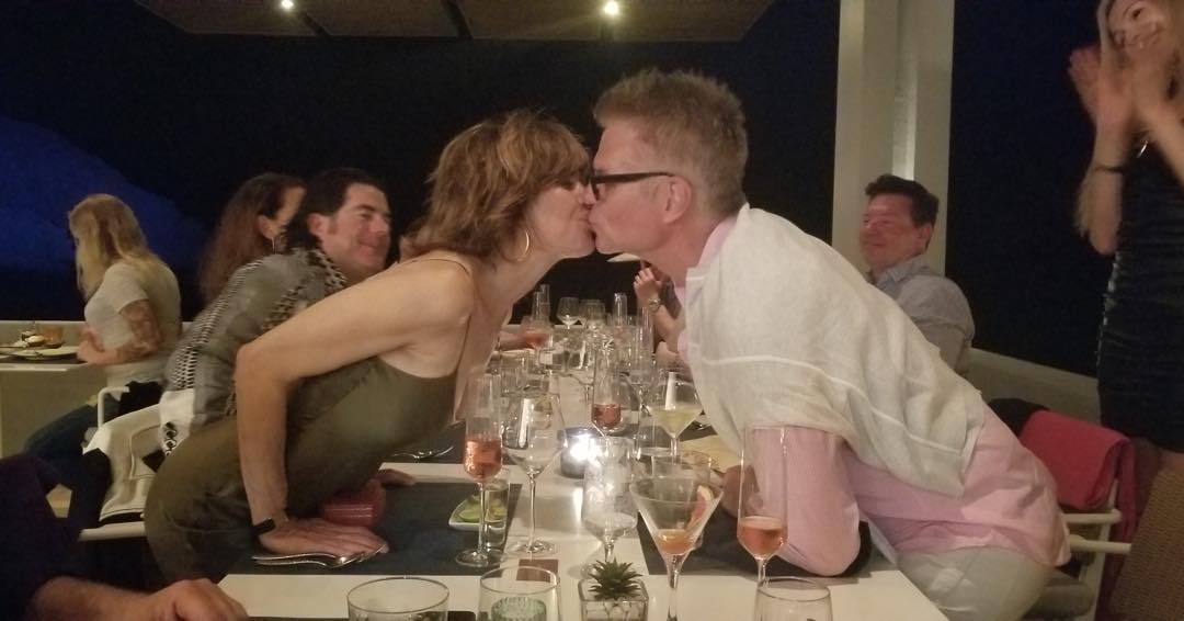 Harry Hamlin and Lisa Rinna kissing at an event