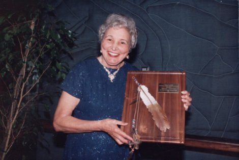 Mary G. Ross holding one of her achievement awards