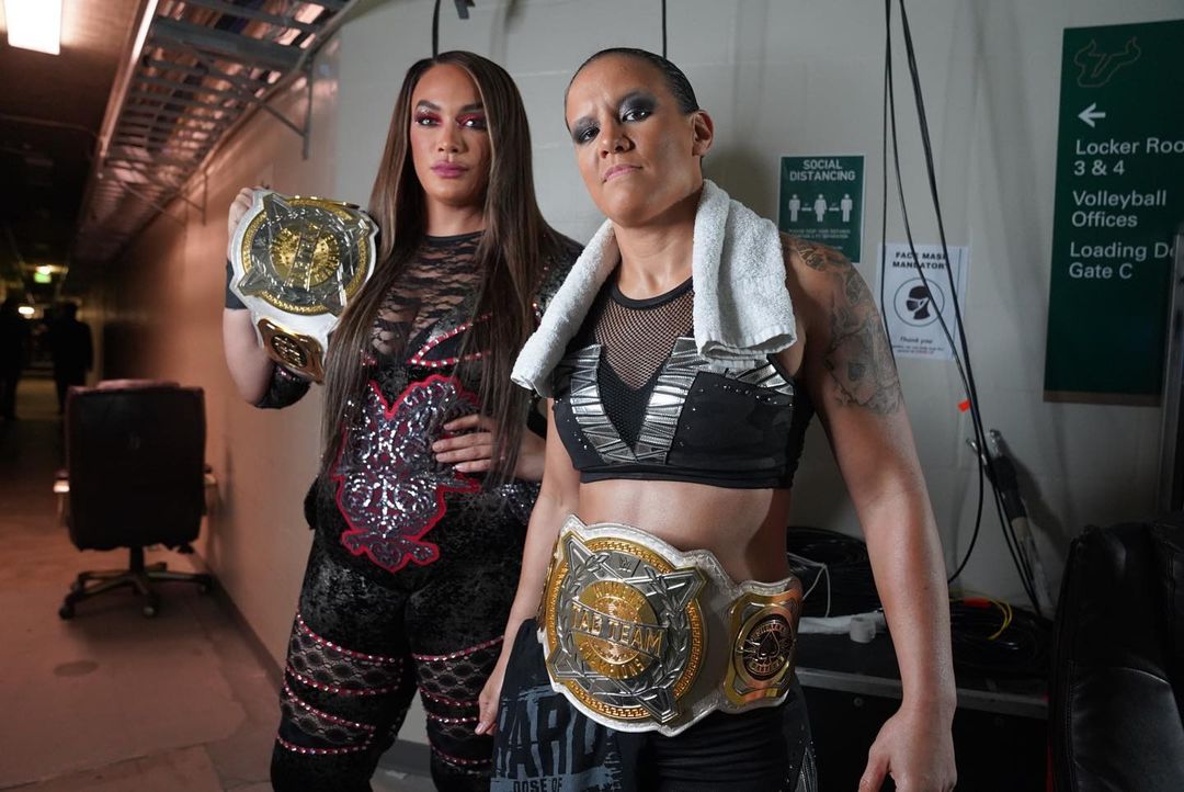 Shayna Baszler and her tag-team partner Nia Jax as the WWE Women's Tag Team Champion