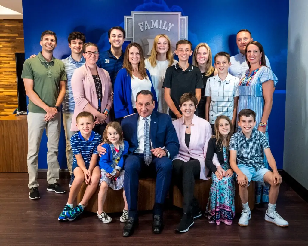 Mike Krzyzewski with his wife, daughters, sons-in-law, and grandchildren at his retirement press conference