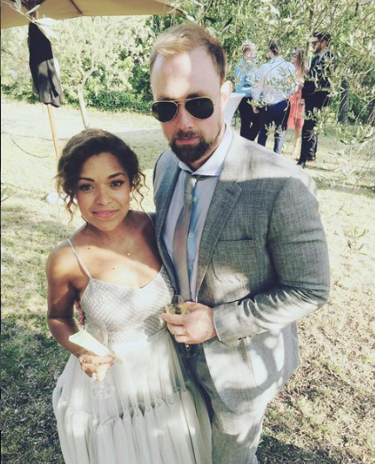 Antonia Thomas and Michael Shelford attending a wedding together.