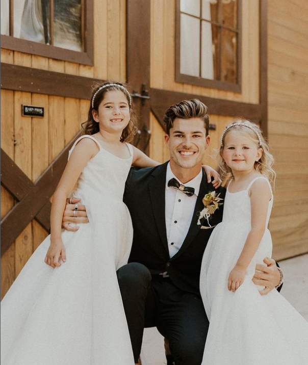 Chase Mattson with his daughters at his wedding. 