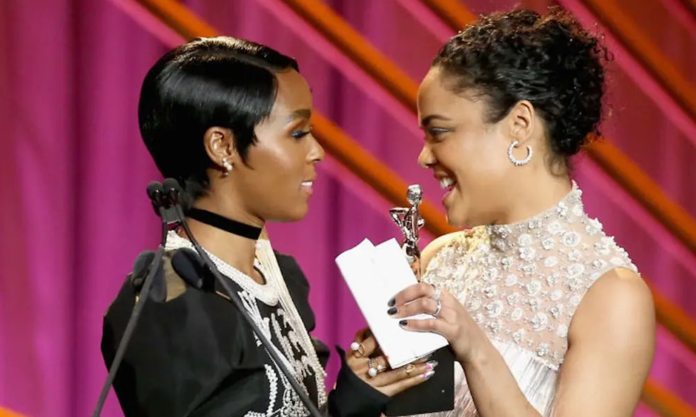 Janelle Monáe with Tessa Thompson during an event.