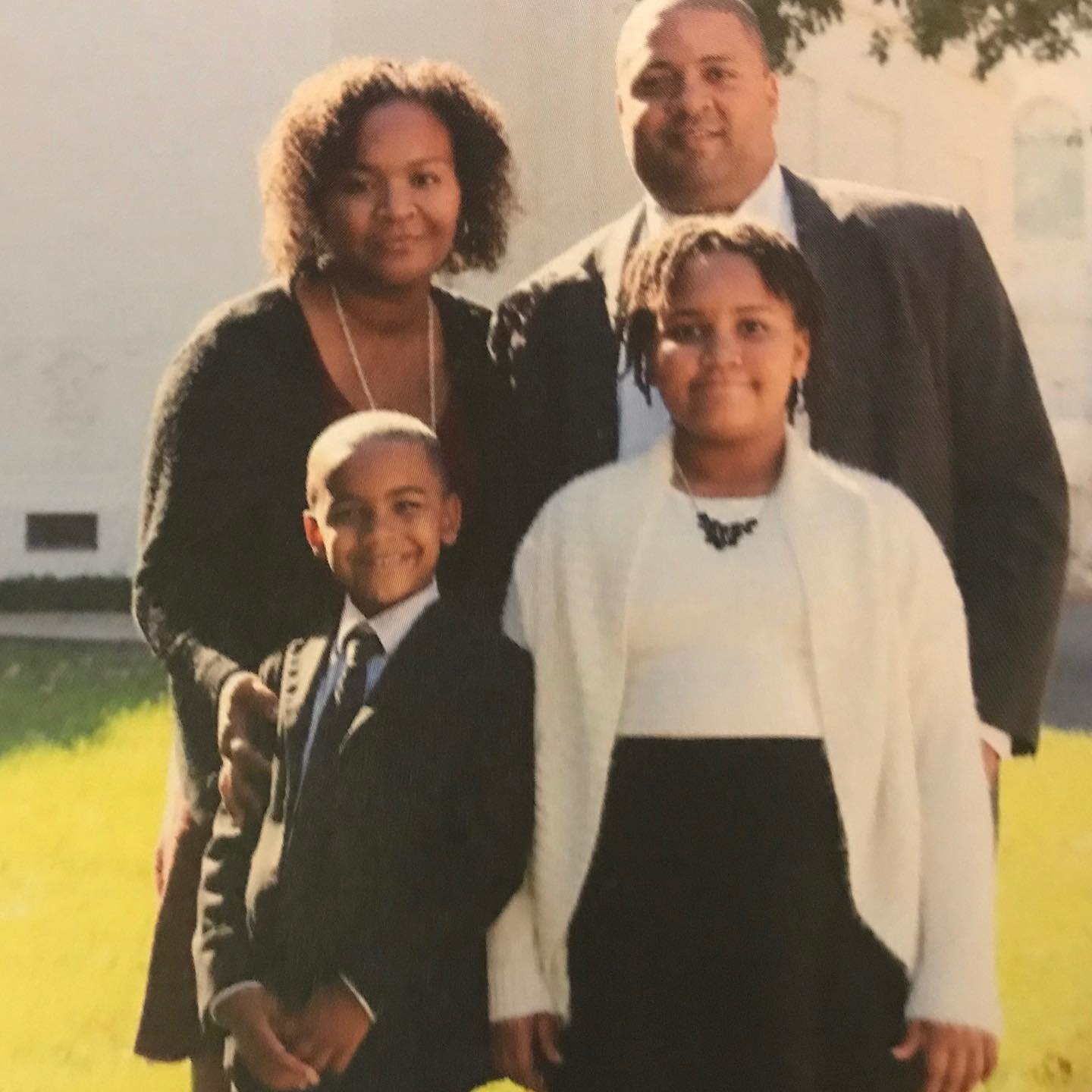 An old picture of Alvin Bragg with his wife, Jamila Ponton Bragg, and their children