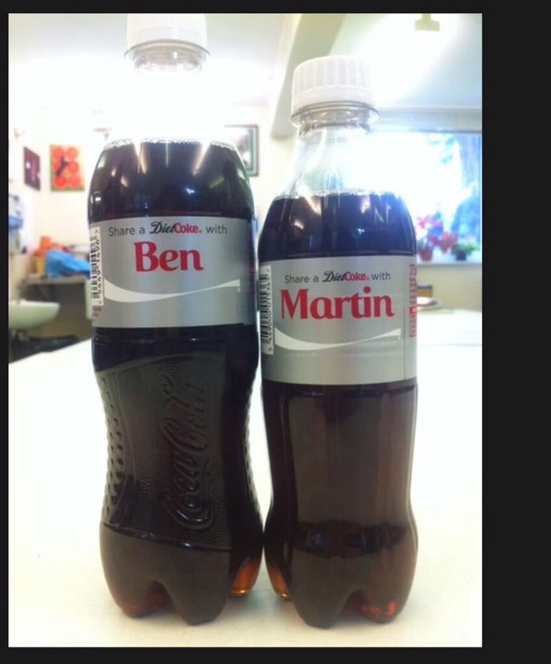 The cokes with differing height labeled with Benedict Cumberbatch and Martin Freeman's names
