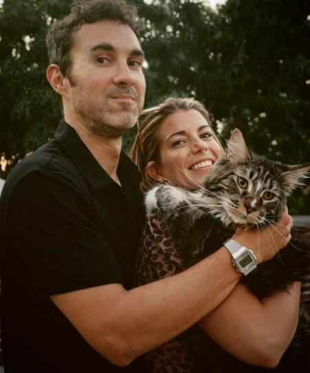 Mark Normand and his wife Mae Planert with their cat