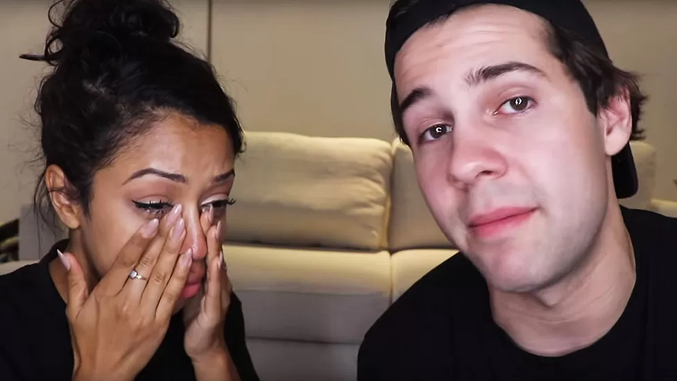 Lisa Koshy and David Dovrik announced their breakup with teary eyes in a YouTube video 
