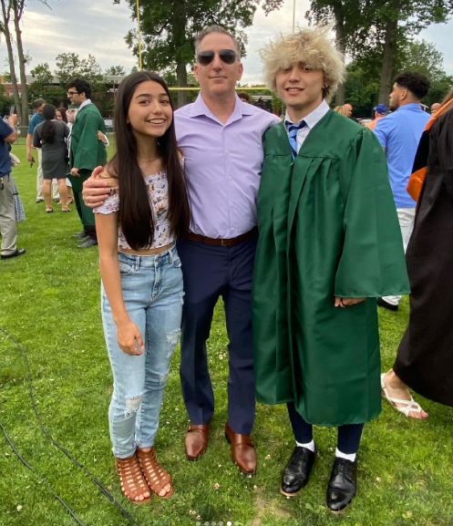 Kairi Cosentino in his graduation ceremony along with his father and sister
