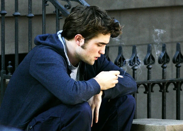 Robert Pattinson smoking a cigarette 