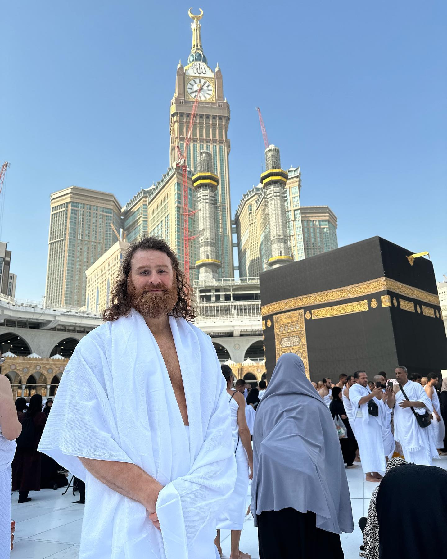 Sami Zayn standing in front of The Kaaba inside Masjid al-Haram
