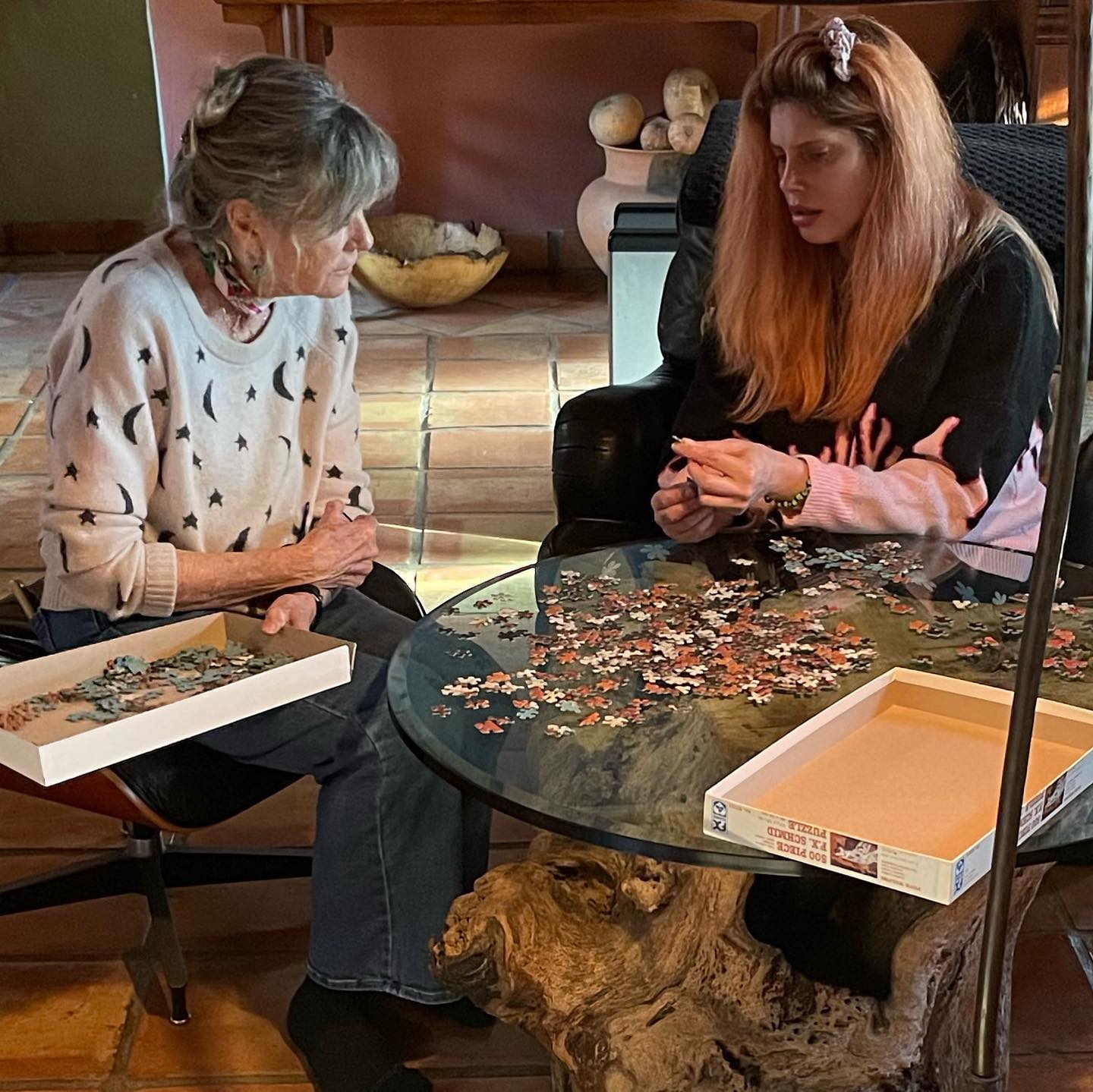Cleo Rose Elliott solving puzzle with her mother Katharine Ross