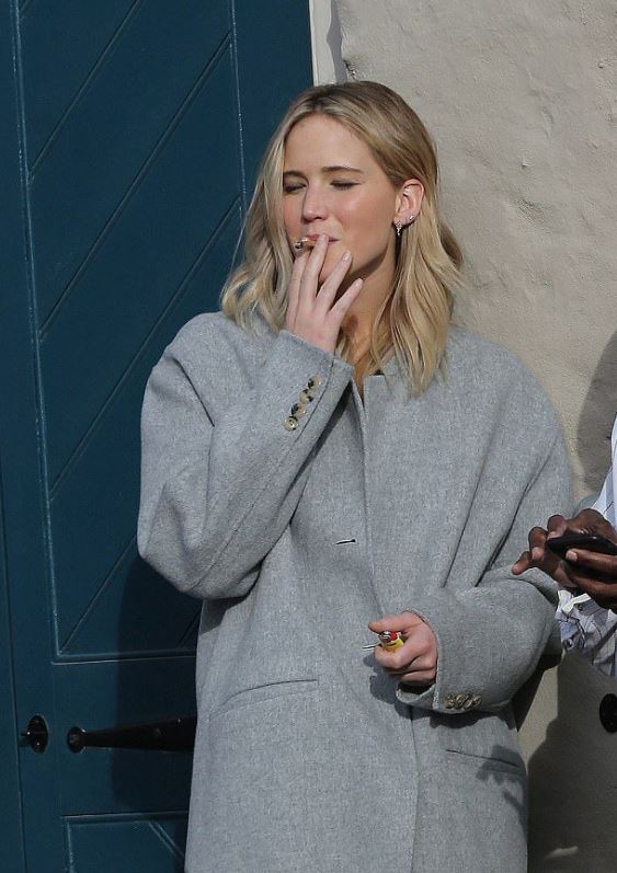 Jennifer Lawrence smoking a cigarette. 