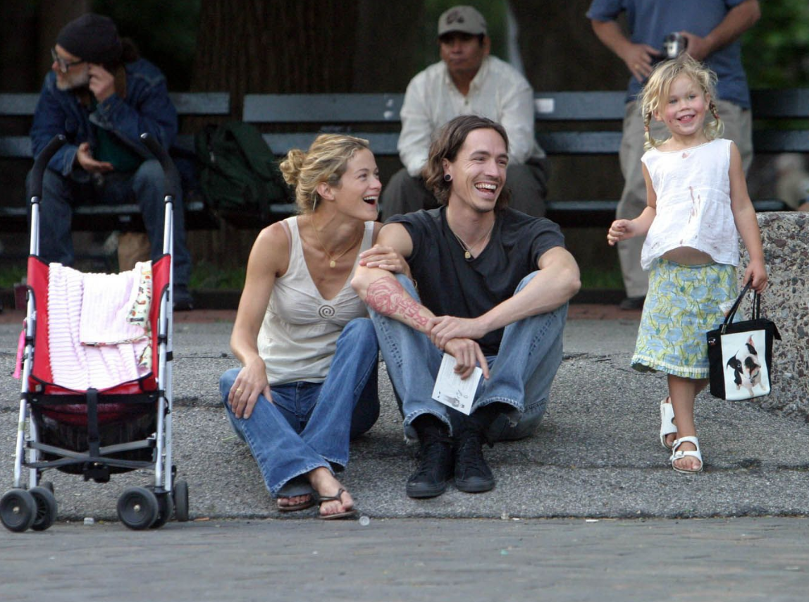 Brandon Boyd with Carolyn Murphy and her daughter. 