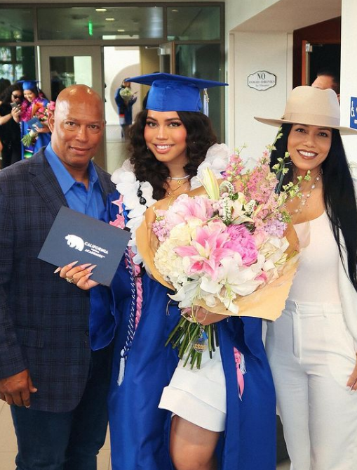 Asia Monet Ray’s parents, Shawn Ray and Kristie Ray at her graduation.