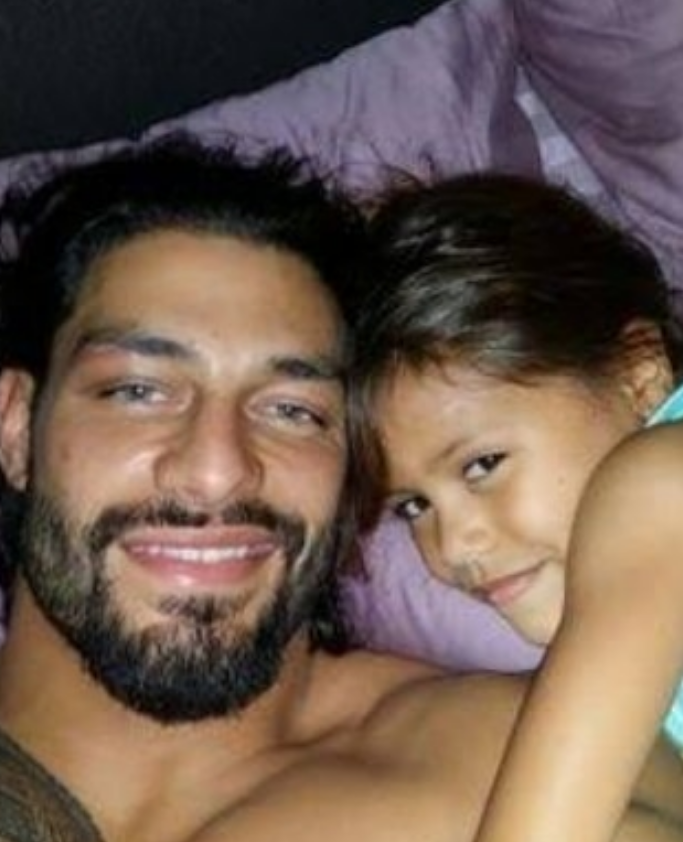 Roman Reigns with his daughter. 