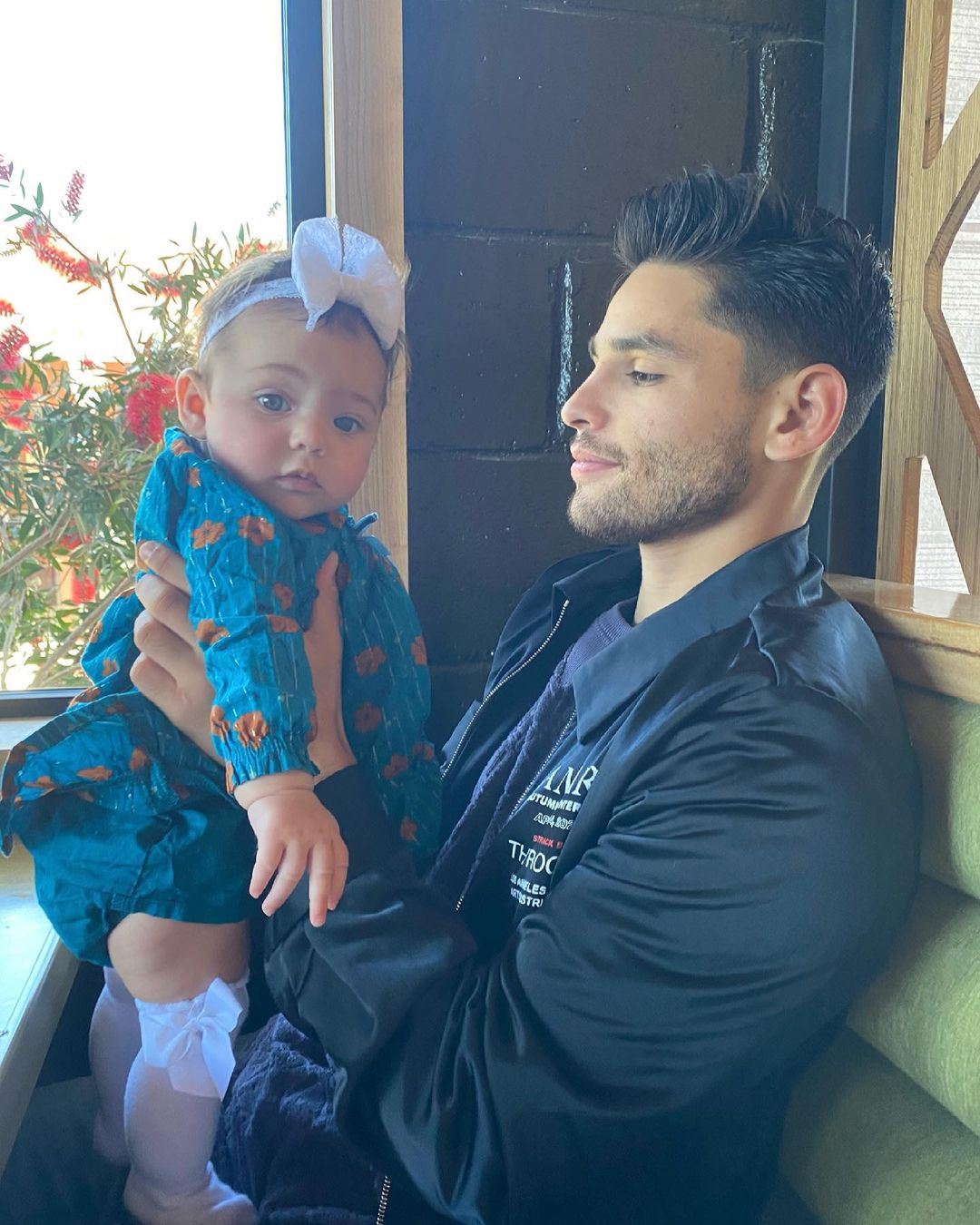 Ryan Garcia holding his baby daughter Bela