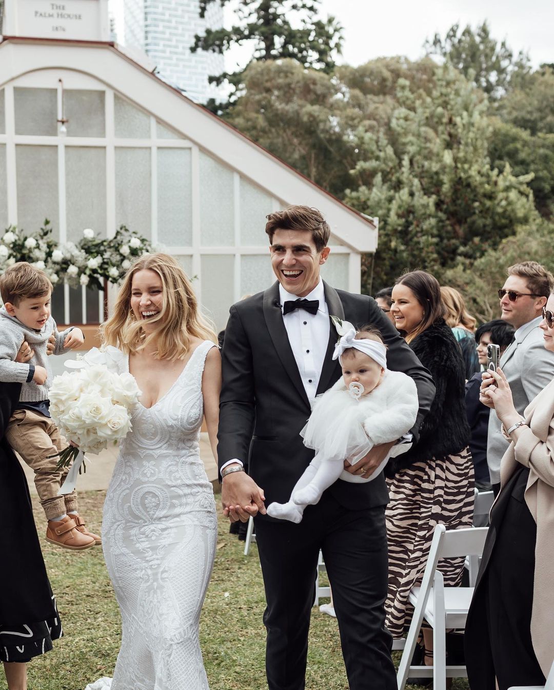 Sean Abbott with his wife, Brier Abbott, and their baby Ella at their wedding
