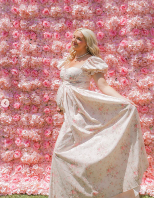 Rydel Funk posing wearing a beautiful floral gown on her second baby shower 