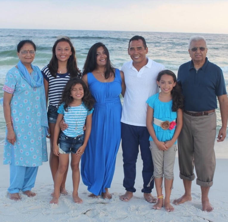 An old picture of Avani Gregg with her parents, siblings, and maternal grandparents