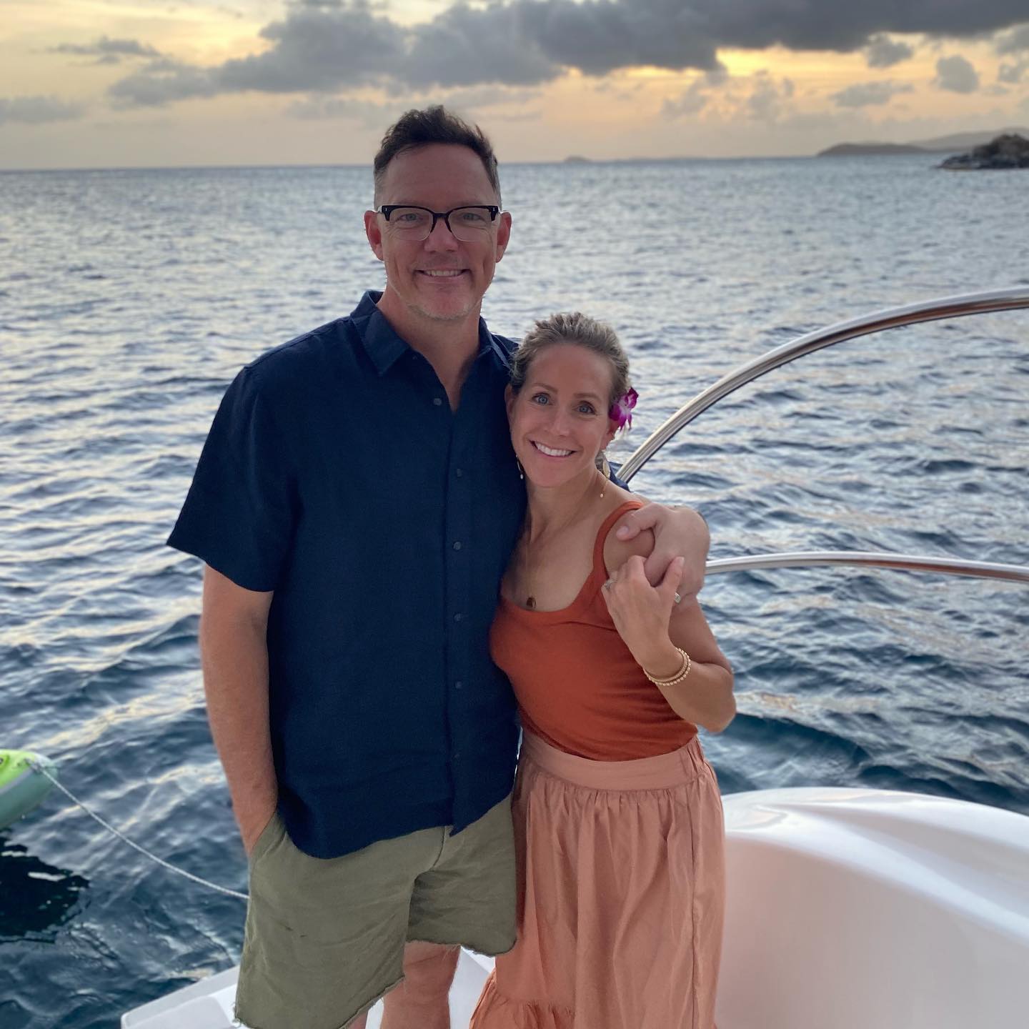 Matthew Lillard standing on a boat with his wife, Heather Helm