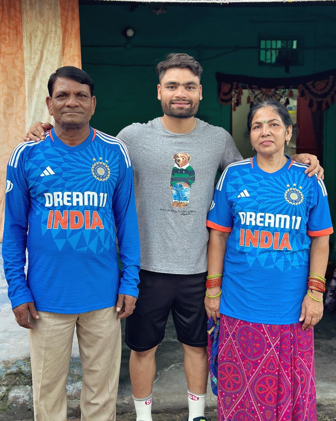 Rinku Singh with his parents who are wearing Team India's jersey after his national team debut