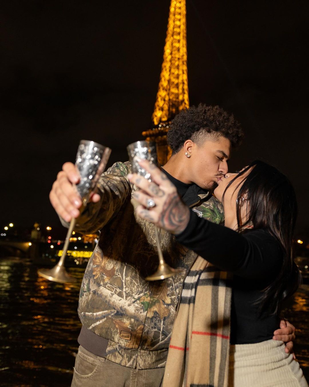 Danielle Cohn and her now-fiance, Brandon, kiss in front of the Eiffel Tower after their engagement