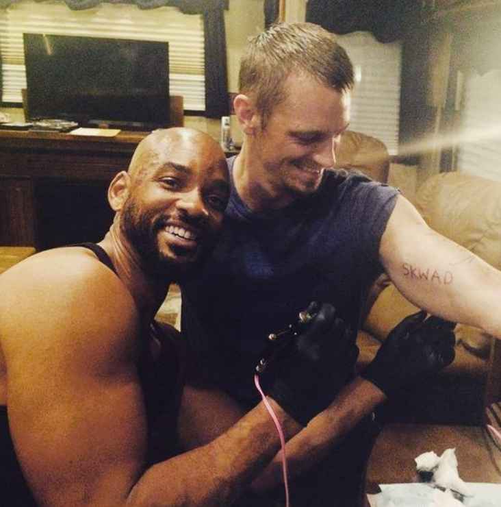 Will Smith tattooed ‘SKWAD’ on Joel Kinnaman's biceps.