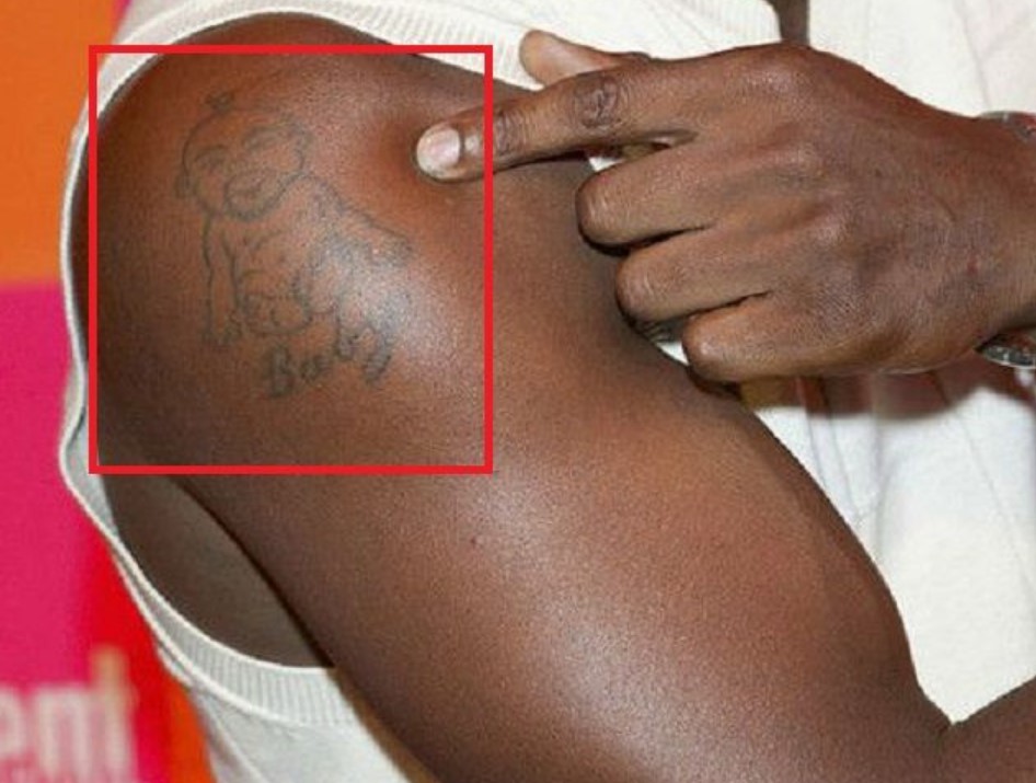 Idris Elba's baby tattoo on his bicep. 