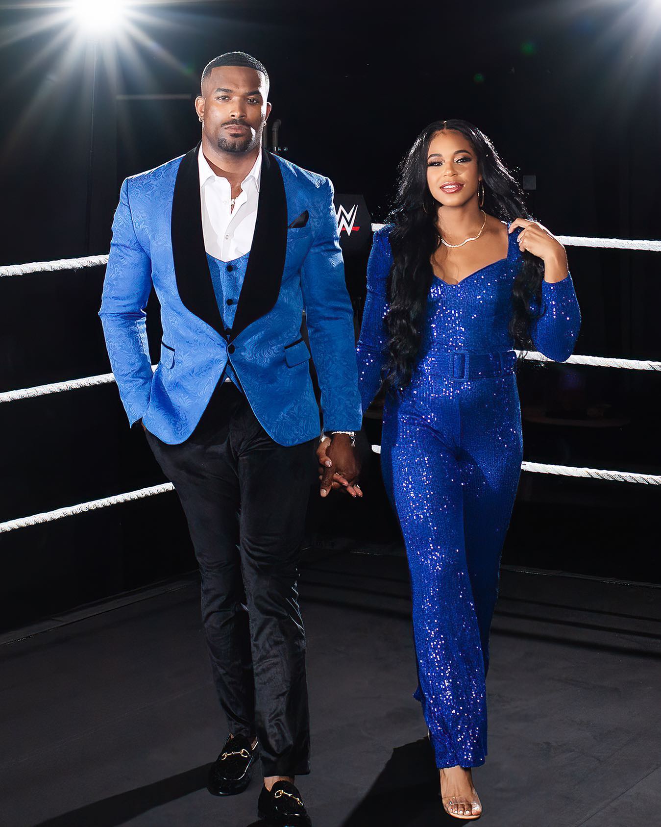 Bianca Belair and her husband, Montez Ford, photographed inside a WWE ring