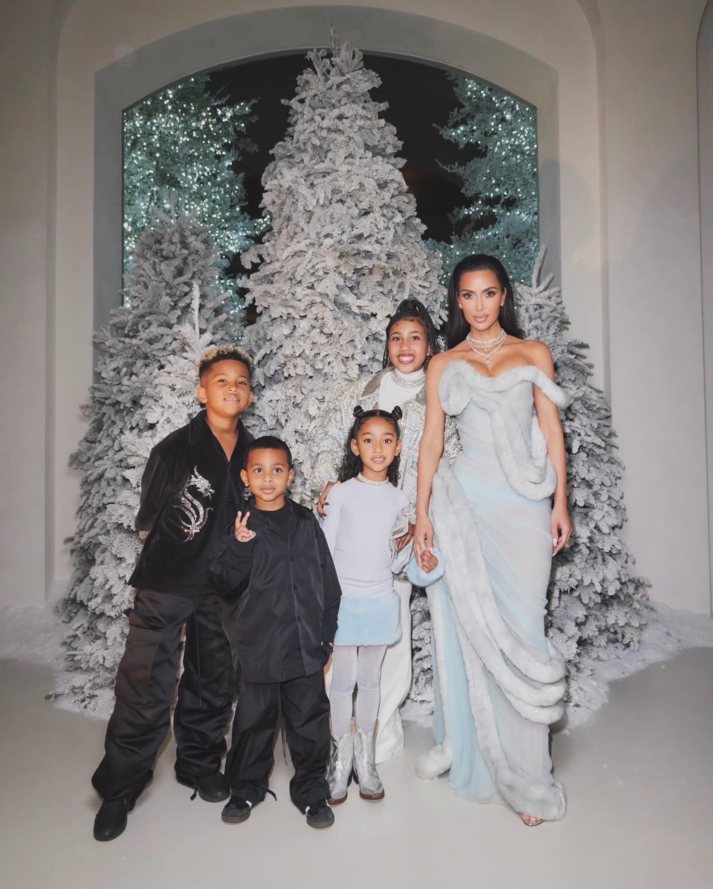 Chicago West with his mom, Kim Kardashian, and her three siblings