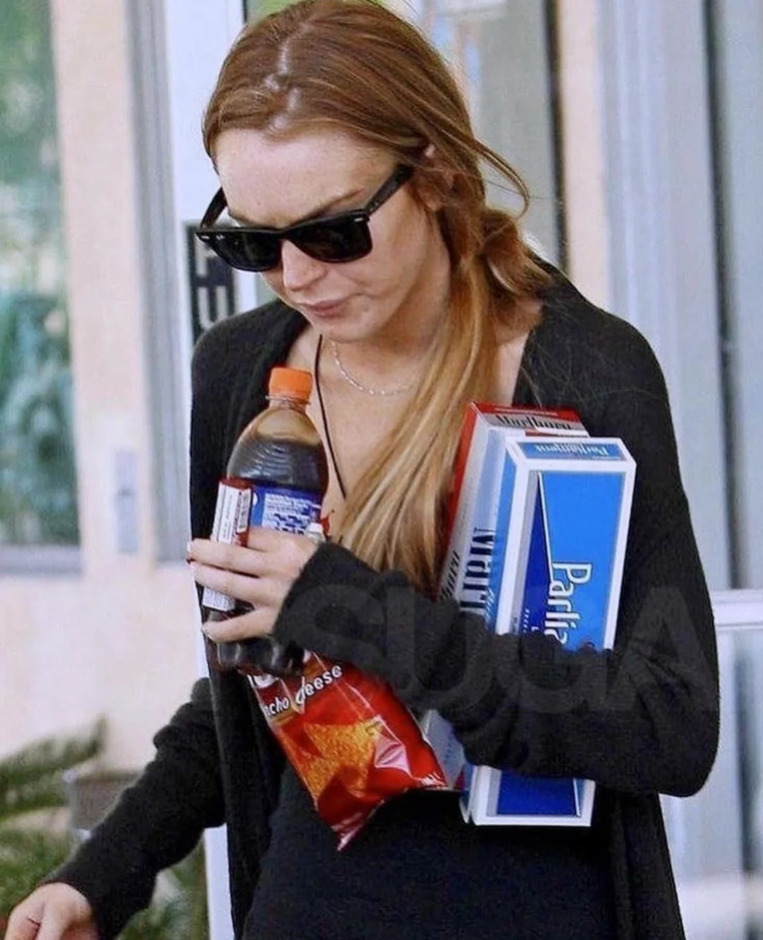 Lindsay Lohan seen leaving a store with two packets of cigarettes in 2008