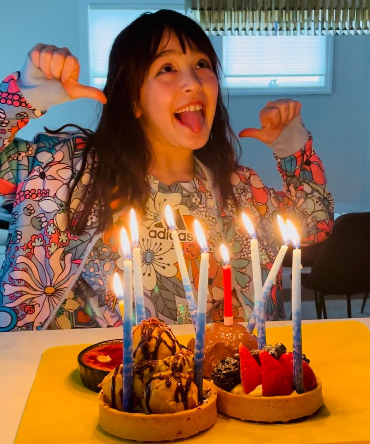 Scarlett Sher celebrating her 9th birthday with a fruit cake